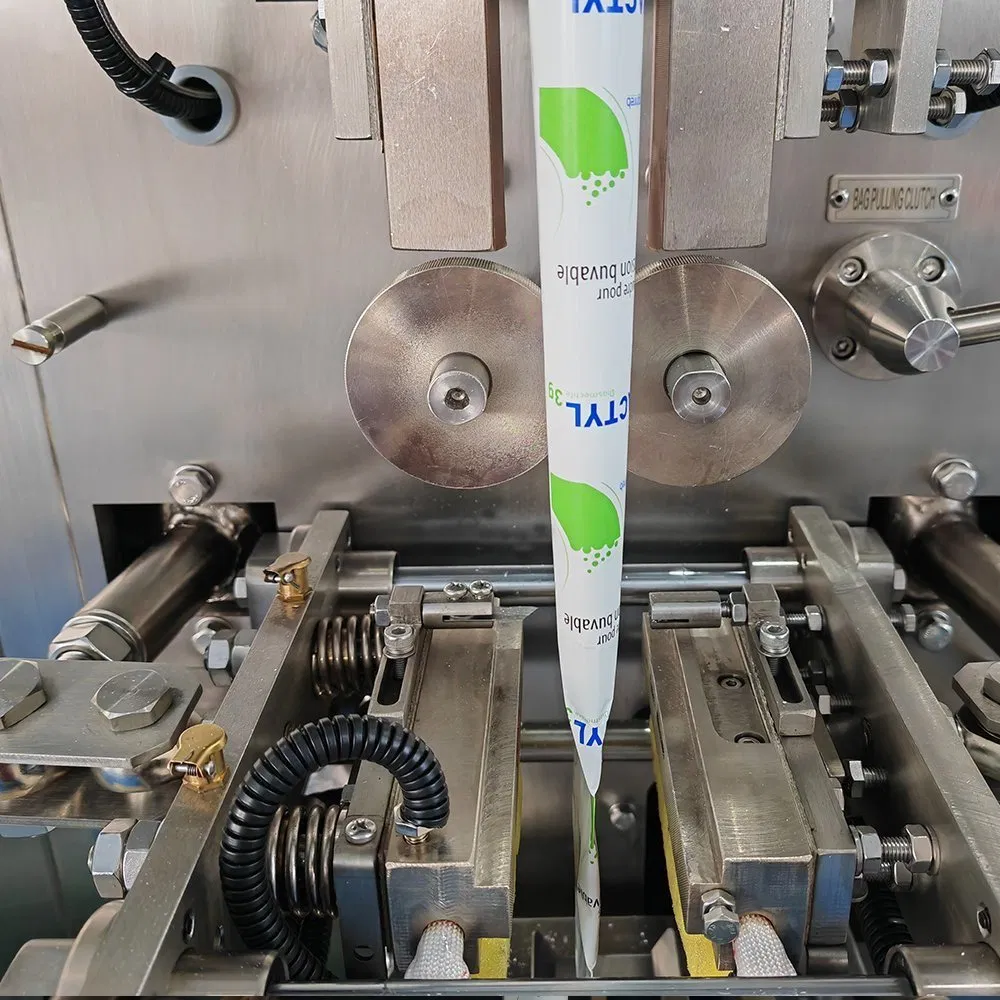 Generic close-up of a single-lane vertical form-fill-seal machine showing forming tube and sealing mechanism